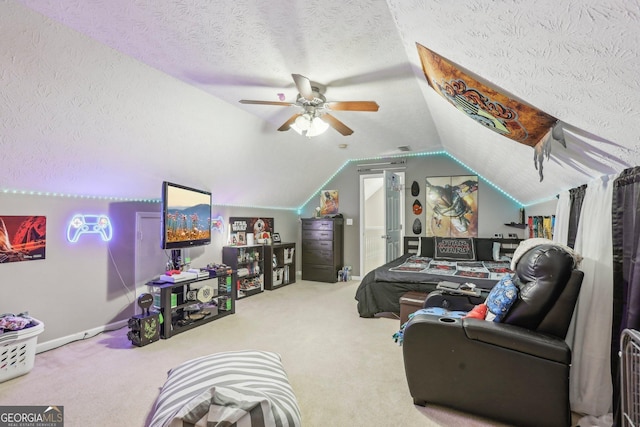 living area featuring lofted ceiling, ceiling fan, a textured ceiling, and carpet