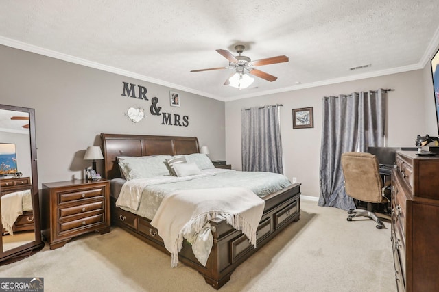 bedroom featuring light carpet, visible vents, crown molding, and a textured ceiling