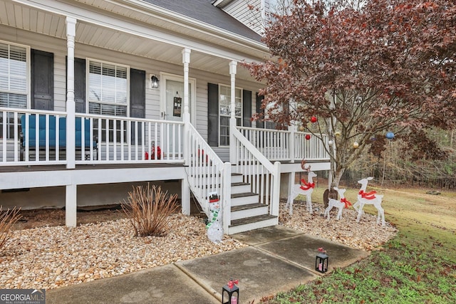 doorway to property featuring covered porch