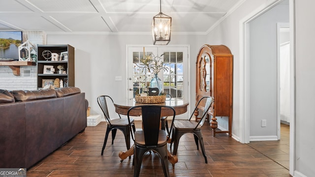 dining room featuring coffered ceiling, a chandelier, dark wood finished floors, and crown molding