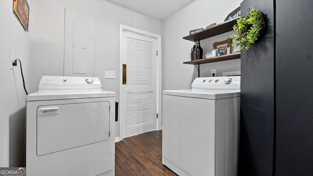 washroom with laundry area, a textured ceiling, dark wood-style flooring, and washing machine and clothes dryer