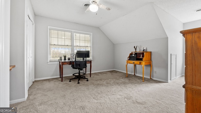 office featuring ceiling fan, visible vents, baseboards, vaulted ceiling, and carpet