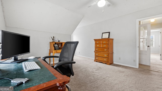 office featuring carpet flooring, vaulted ceiling, and baseboards