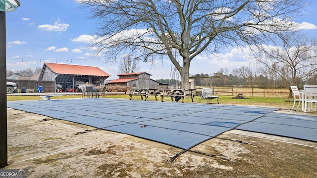 view of swimming pool with a fenced in pool, a patio area, and fence