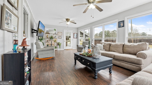 living room with wood finished floors and baseboards