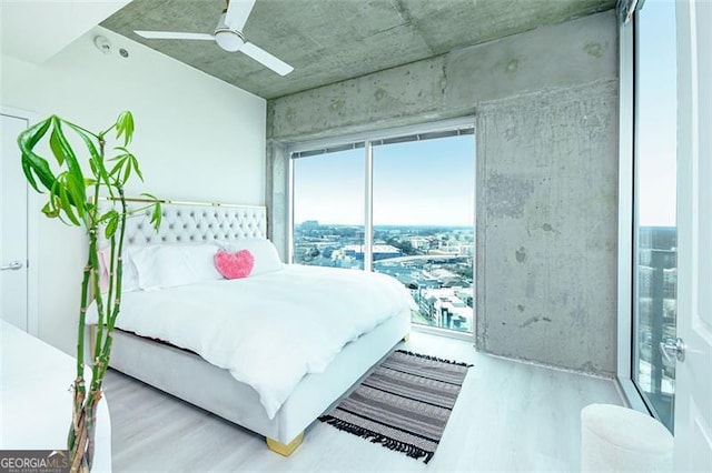 361 17th St Unit 2122, Atlanta, GA 30363 - bedroom featuring wood finished floors and a ceiling fan