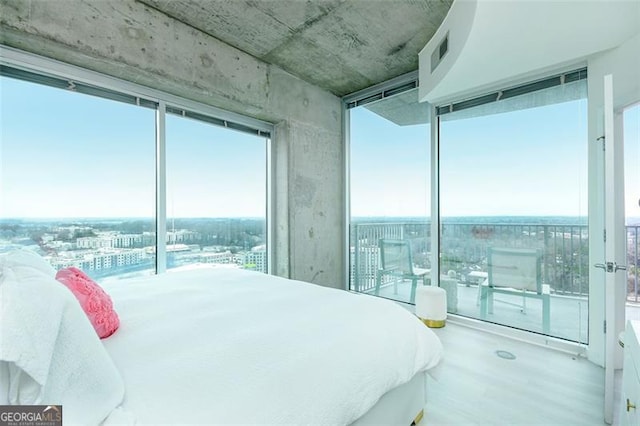 361 17th St Unit 2122, Atlanta, GA 30363 - bedroom featuring wood finished floors and floor to ceiling windows