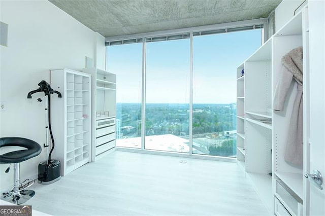 361 17th St Unit 2122, Atlanta, GA 30363 - unfurnished bedroom with wood finished floors and floor to ceiling windows