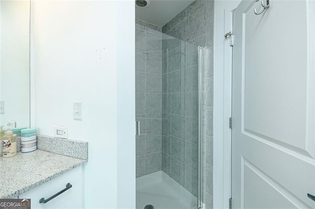 361 17th St Unit 2122, Atlanta, GA 30363 - bathroom featuring a shower stall and vanity