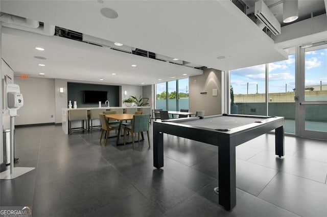 rec room with baseboards, a wall of windows, billiards, and recessed lighting