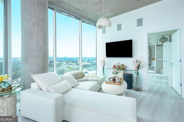 361 17th St Unit 2122, Atlanta, GA 30363 - living room with wood finished floors and floor to ceiling windows