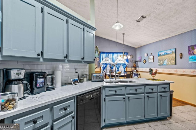 kitchen with pendant lighting, black dishwasher, visible vents, a sink, and a peninsula