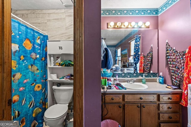 full bath featuring toilet, curtained shower, a textured ceiling, and vanity