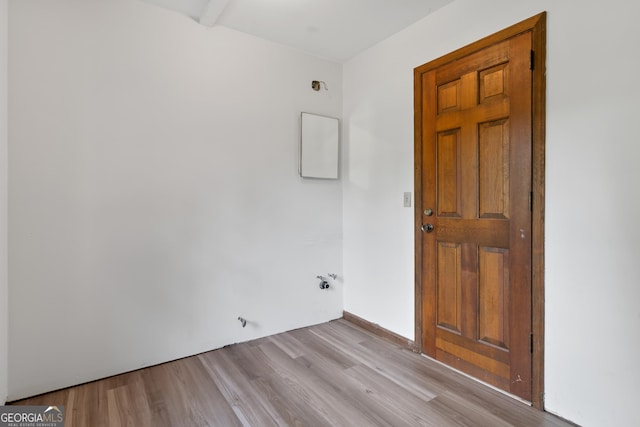 unfurnished room with light wood-type flooring