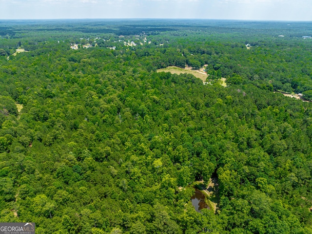 bird's eye view featuring a view of trees