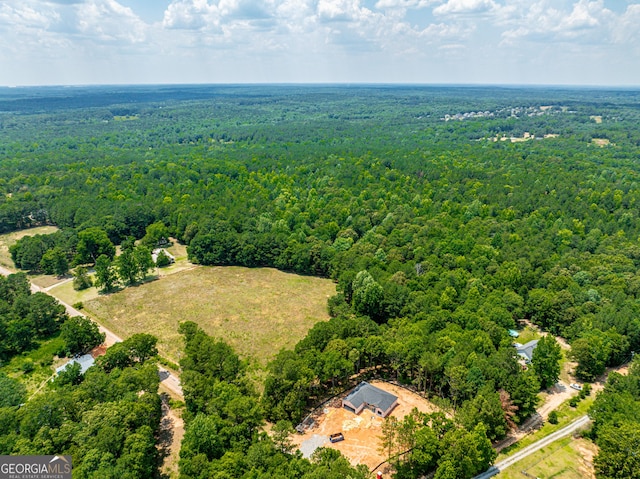 aerial view with a wooded view