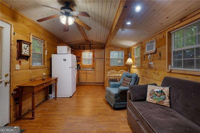 living area featuring vaulted ceiling with beams, wooden ceiling, light wood-type flooring, and wooden walls