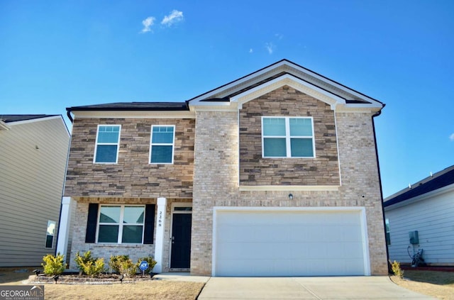 view of front facade featuring a garage, driveway, and brick siding