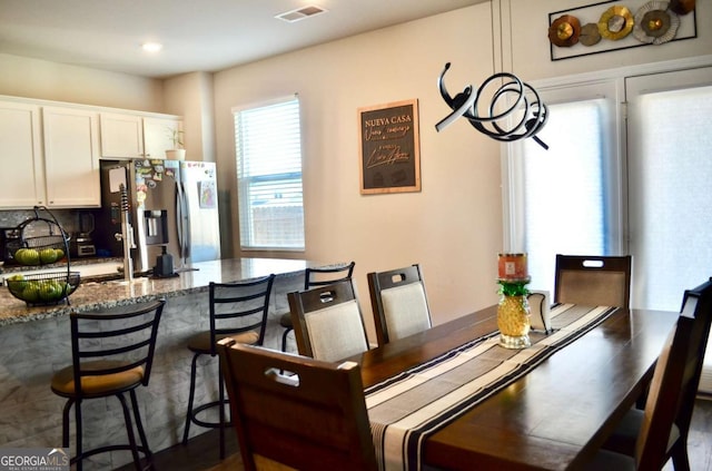 dining space with visible vents