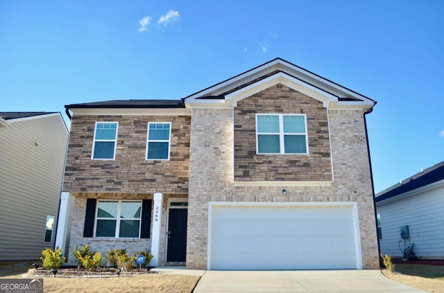 view of front of property featuring a garage, brick siding, and driveway