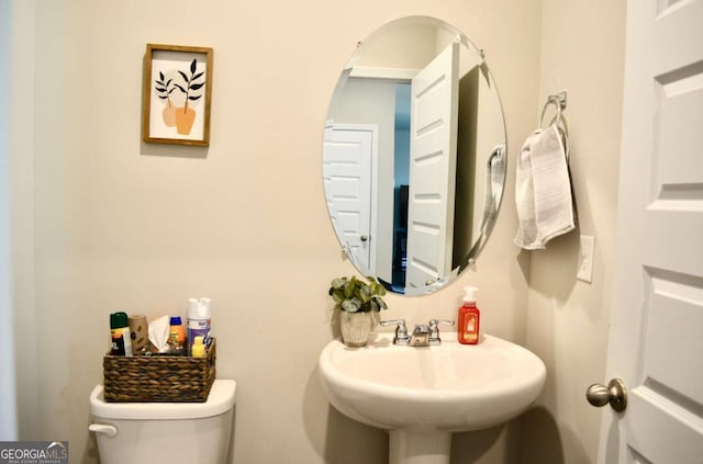 bathroom with a sink and toilet