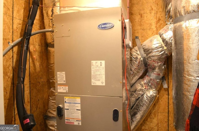 utility room with heating unit