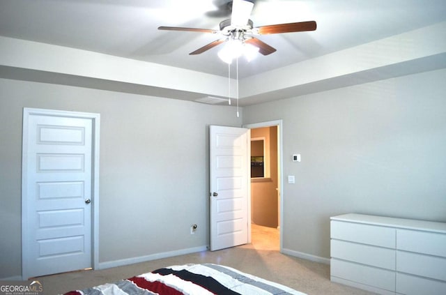 unfurnished bedroom featuring ceiling fan, baseboards, and carpet flooring