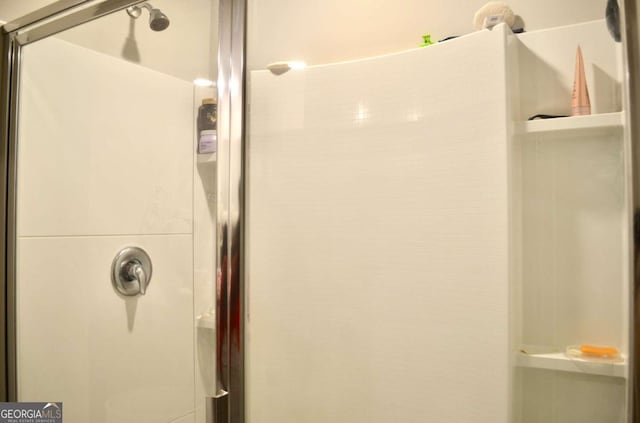 bathroom featuring a shower stall