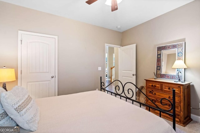 bedroom with carpet, ceiling fan, and baseboards