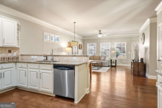 kitchen with dark wood-style floors, backsplash, stainless steel dishwasher, a sink, and a peninsula