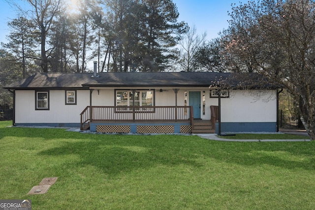 ranch-style house featuring covered porch, crawl space, and a front yard