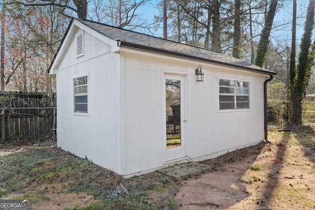 view of outdoor structure with fence and an outdoor structure