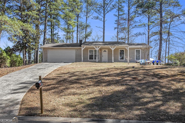 view of front facade featuring driveway and an attached garage