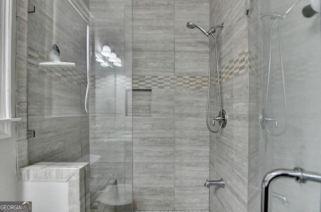 full bath featuring a shower stall