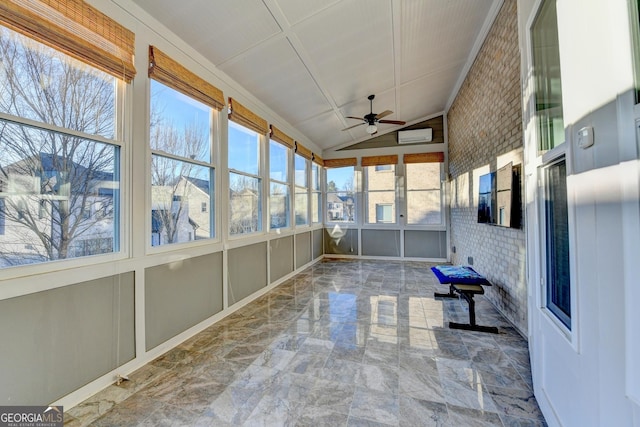 unfurnished sunroom with a ceiling fan, an AC wall unit, and vaulted ceiling