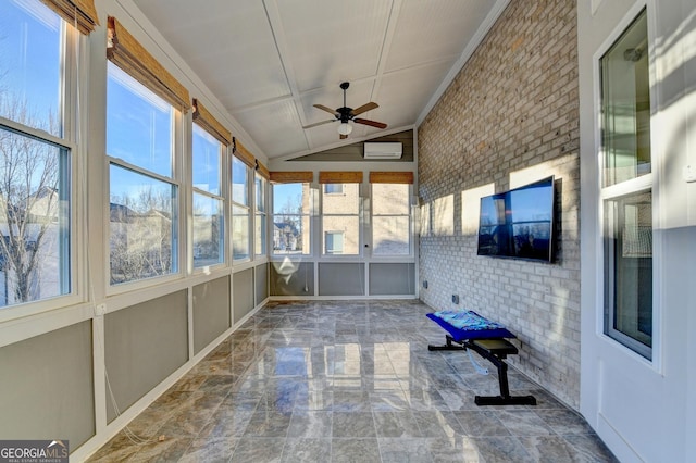 unfurnished sunroom with lofted ceiling, ceiling fan, and a wall unit AC