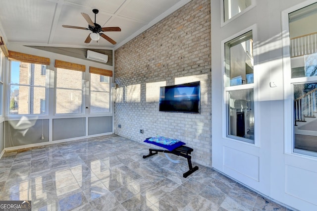 unfurnished sunroom featuring a wall unit AC and ceiling fan