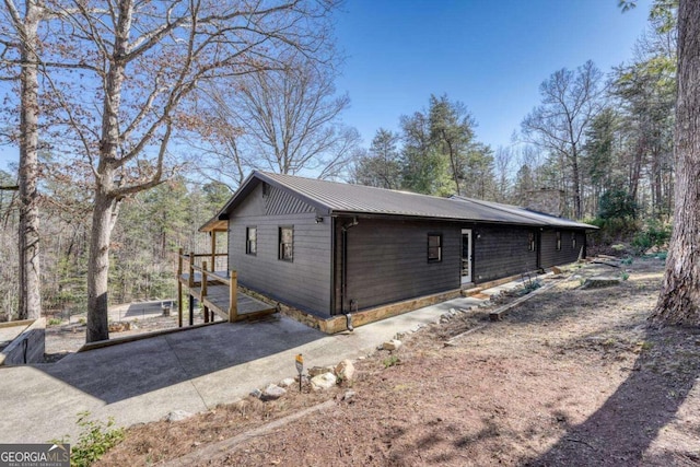 view of home's exterior featuring metal roof