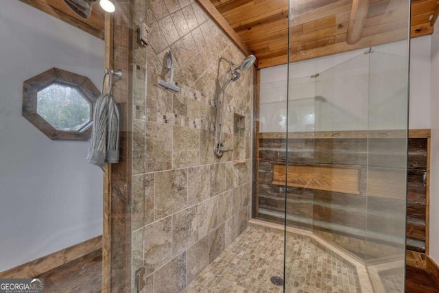 full bathroom with a stall shower and wood ceiling