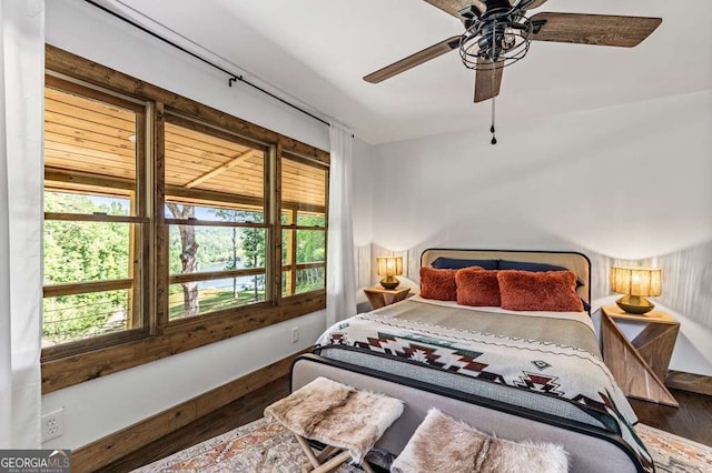 bedroom with wood finished floors and a ceiling fan