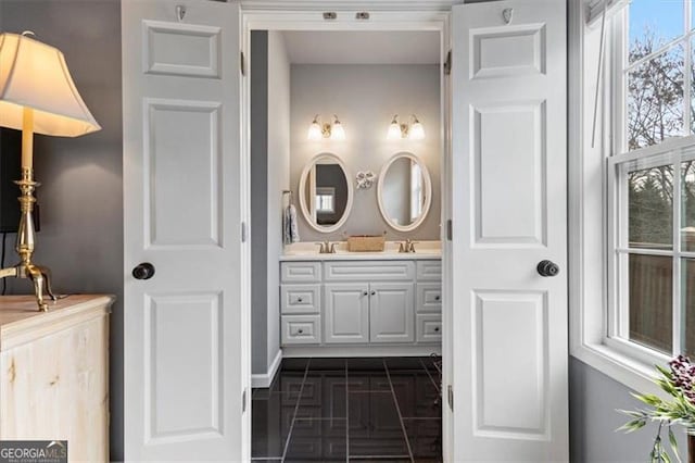 bathroom with double vanity and a sink