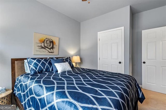 bedroom with a ceiling fan and carpet flooring