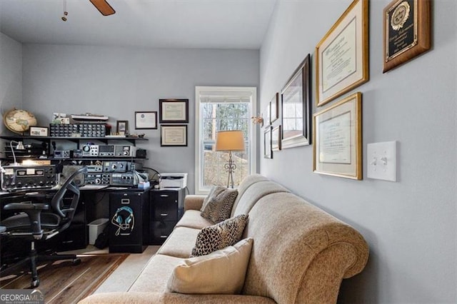 office space with a ceiling fan and wood finished floors