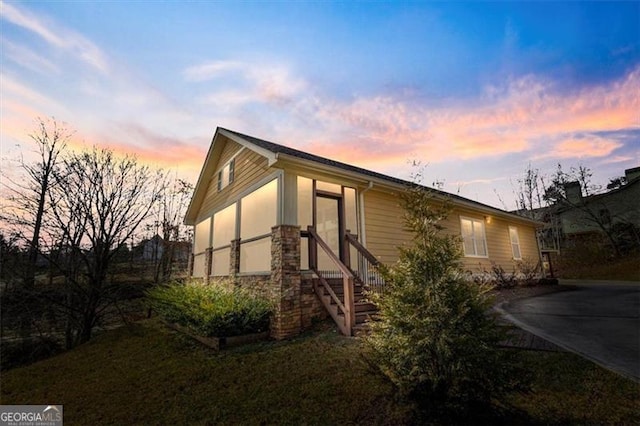 exterior space featuring stone siding