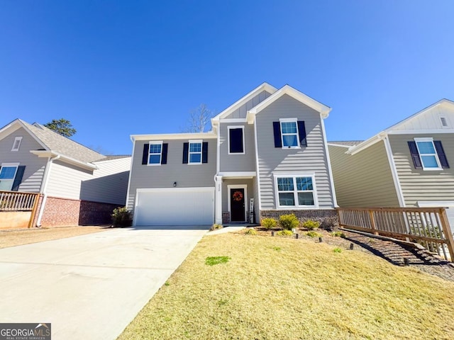 view of front of home with board and batten siding, concrete driveway, a front lawn, and an attached garage