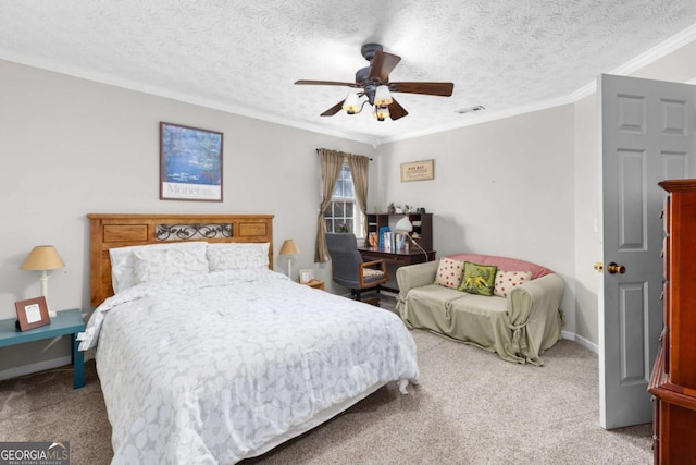 bedroom with carpet floors, crown molding, ceiling fan, a textured ceiling, and baseboards