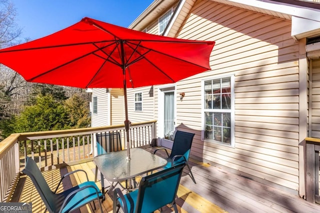 deck featuring outdoor dining space