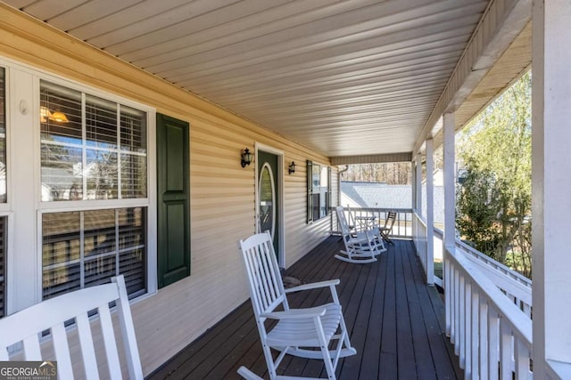 wooden terrace with a porch