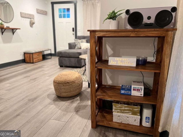 interior space featuring wood finished floors and baseboards