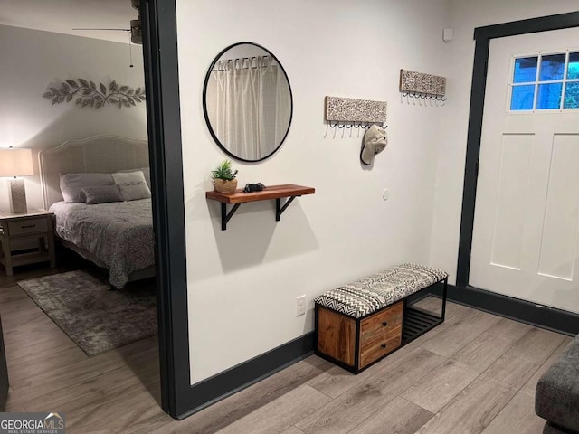 entrance foyer featuring baseboards and wood finished floors